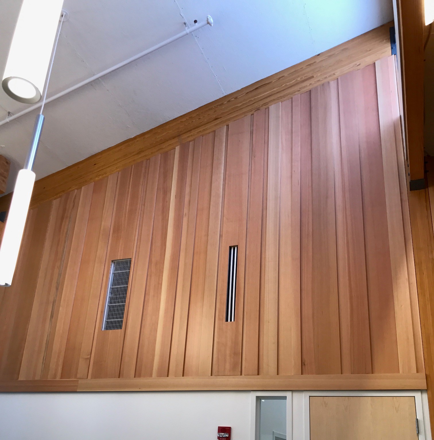 Custom reception desk with wood veneer panels for a corporate office (portfolio image 21)