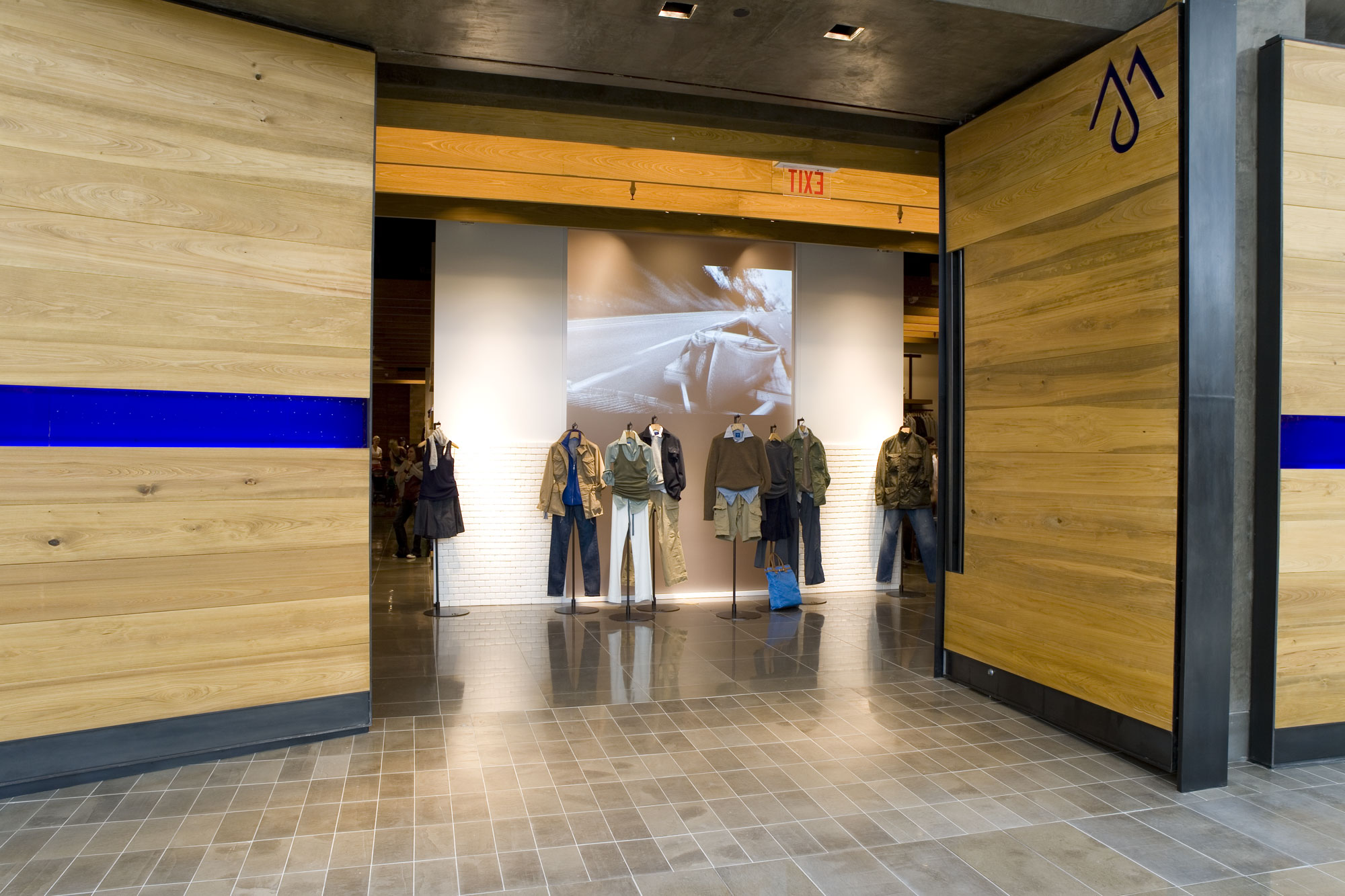 Retail fixture package with display islands and back-of-house storage (portfolio image 16)