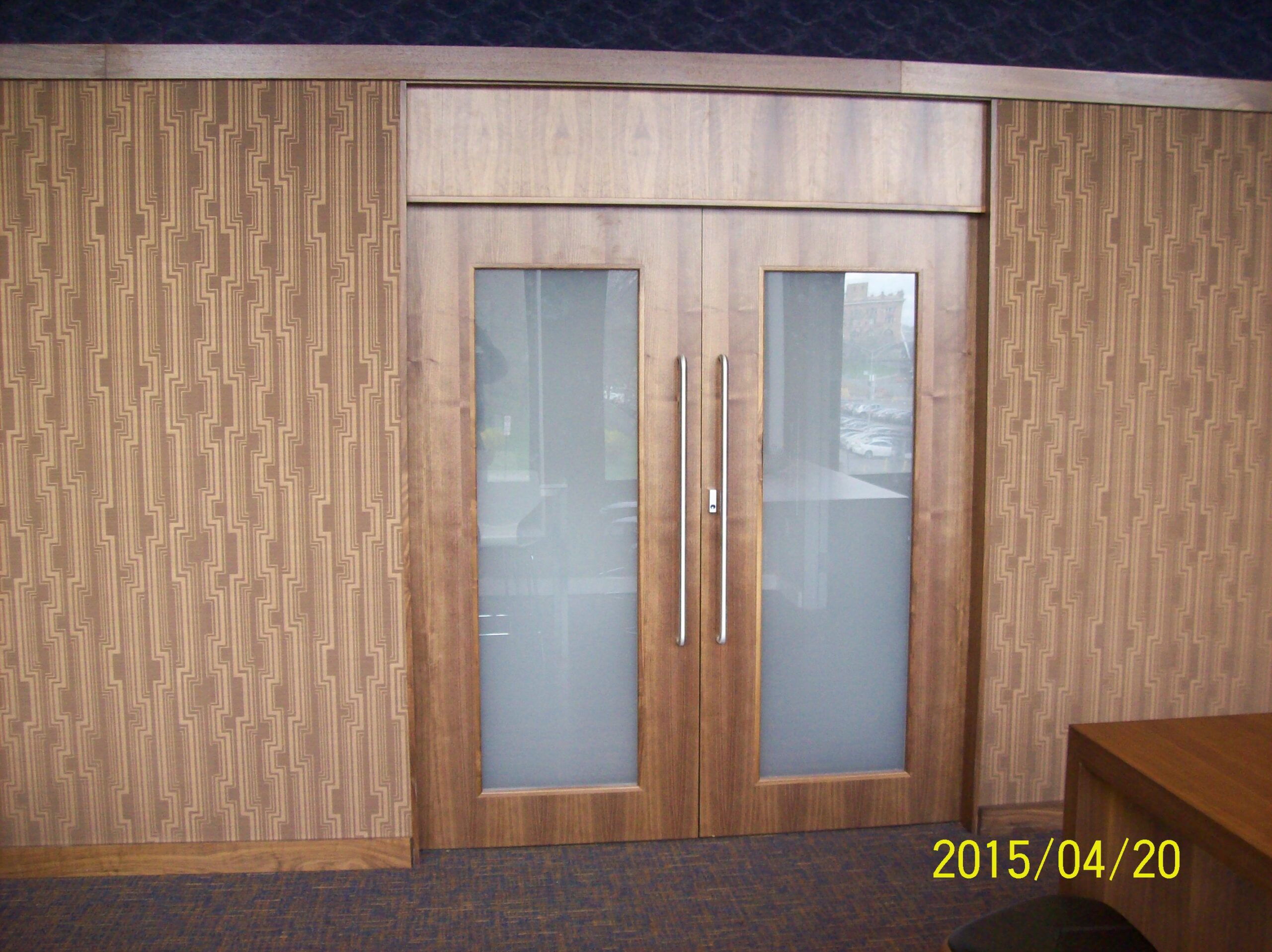 Hotel lobby millwork with custom front desk and feature panels (portfolio image 17)