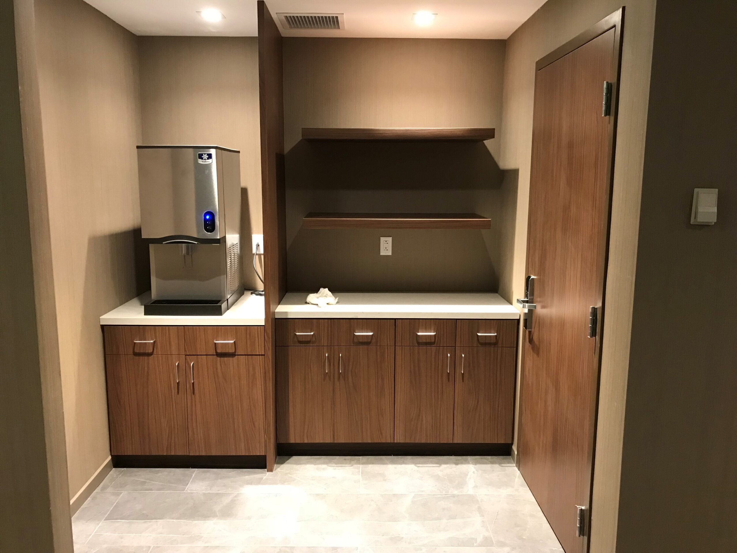 Hotel lobby millwork with custom front desk and feature panels (portfolio image 25)