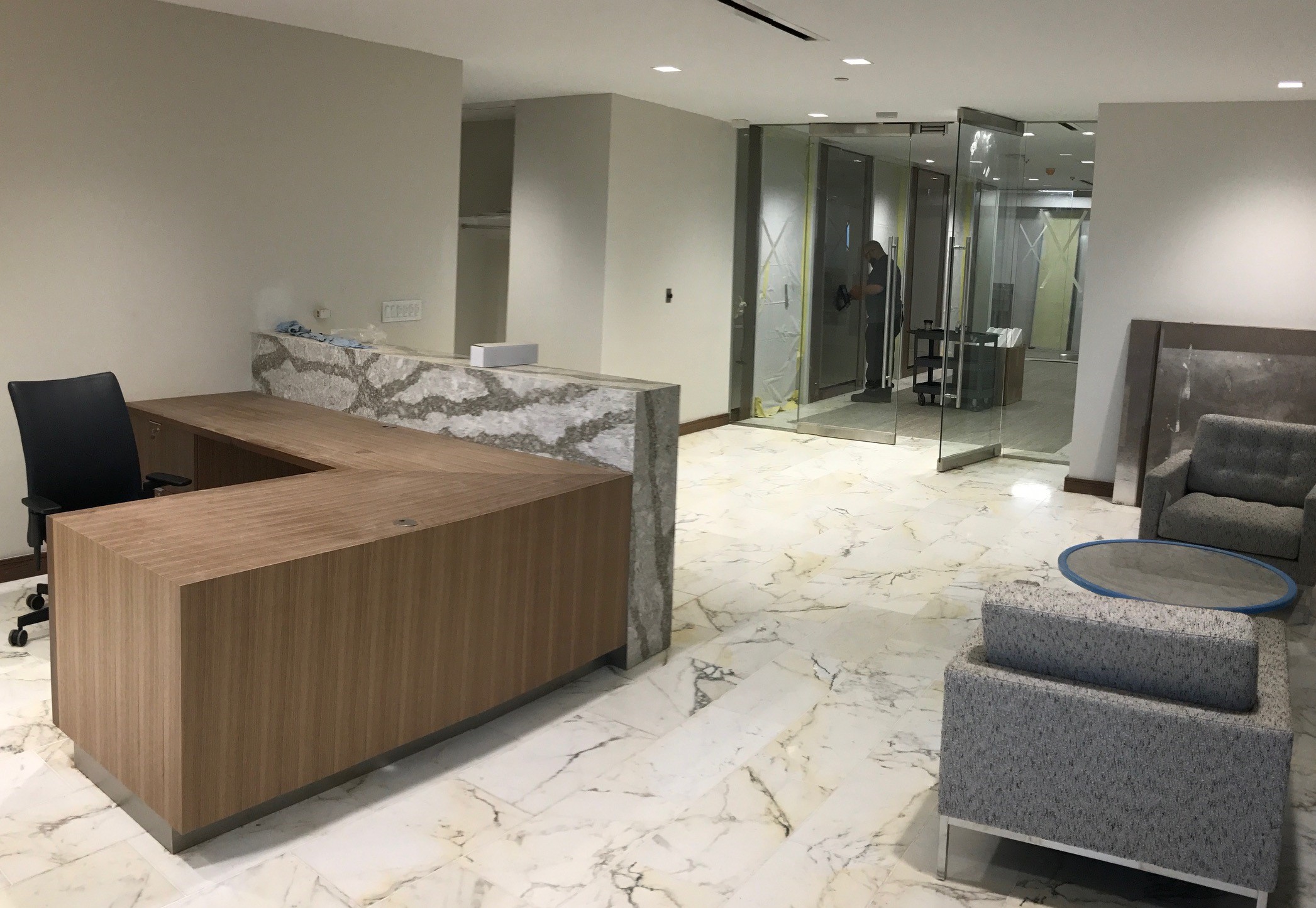 Custom reception desk with wood veneer panels for a corporate office (portfolio image 6)