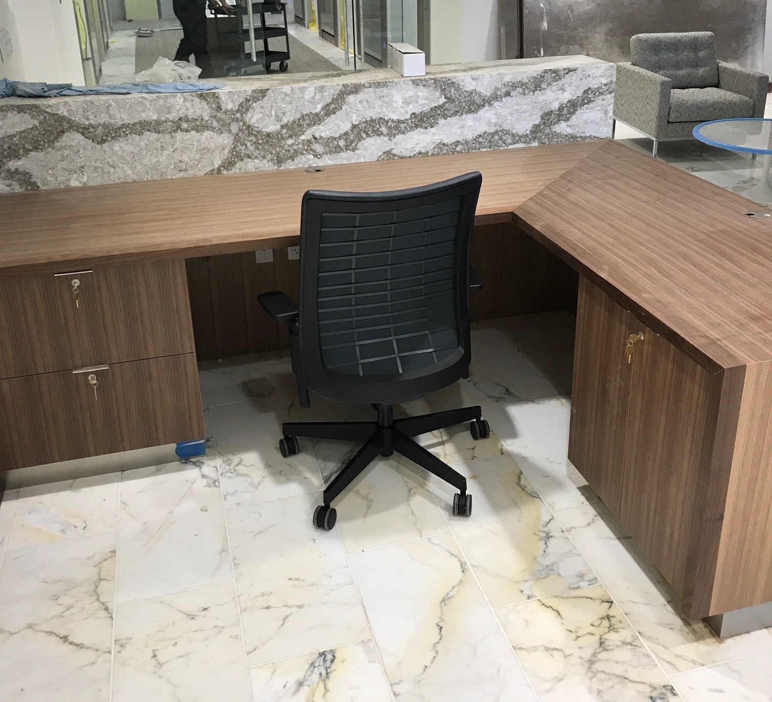 Custom reception desk with wood veneer panels for a corporate office (portfolio image 16)
