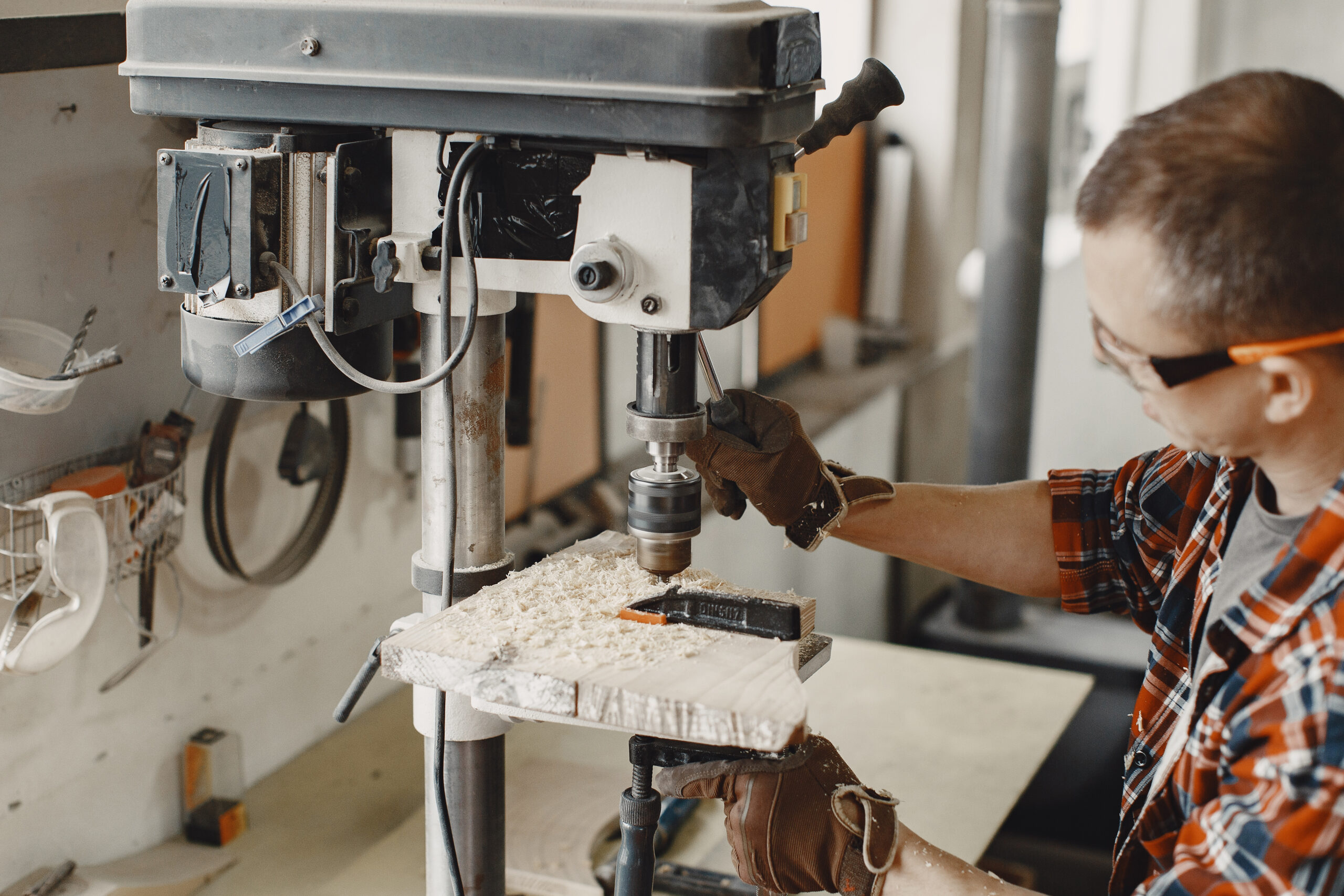 Tech 2000 Woodworks craftsman using a drill in the Jeannette, PA shop